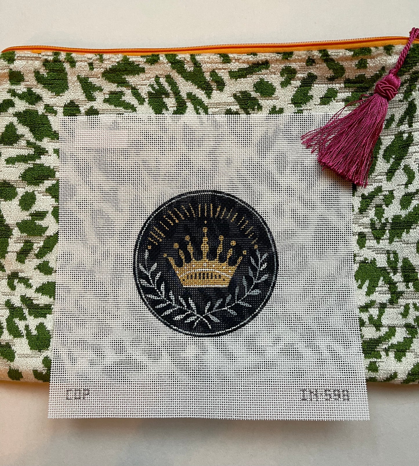 Anna Clutch #7: Crown canvas on green animal print patterned clutch